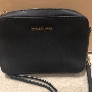 Michael Kors black cross body with gold zipper, like new